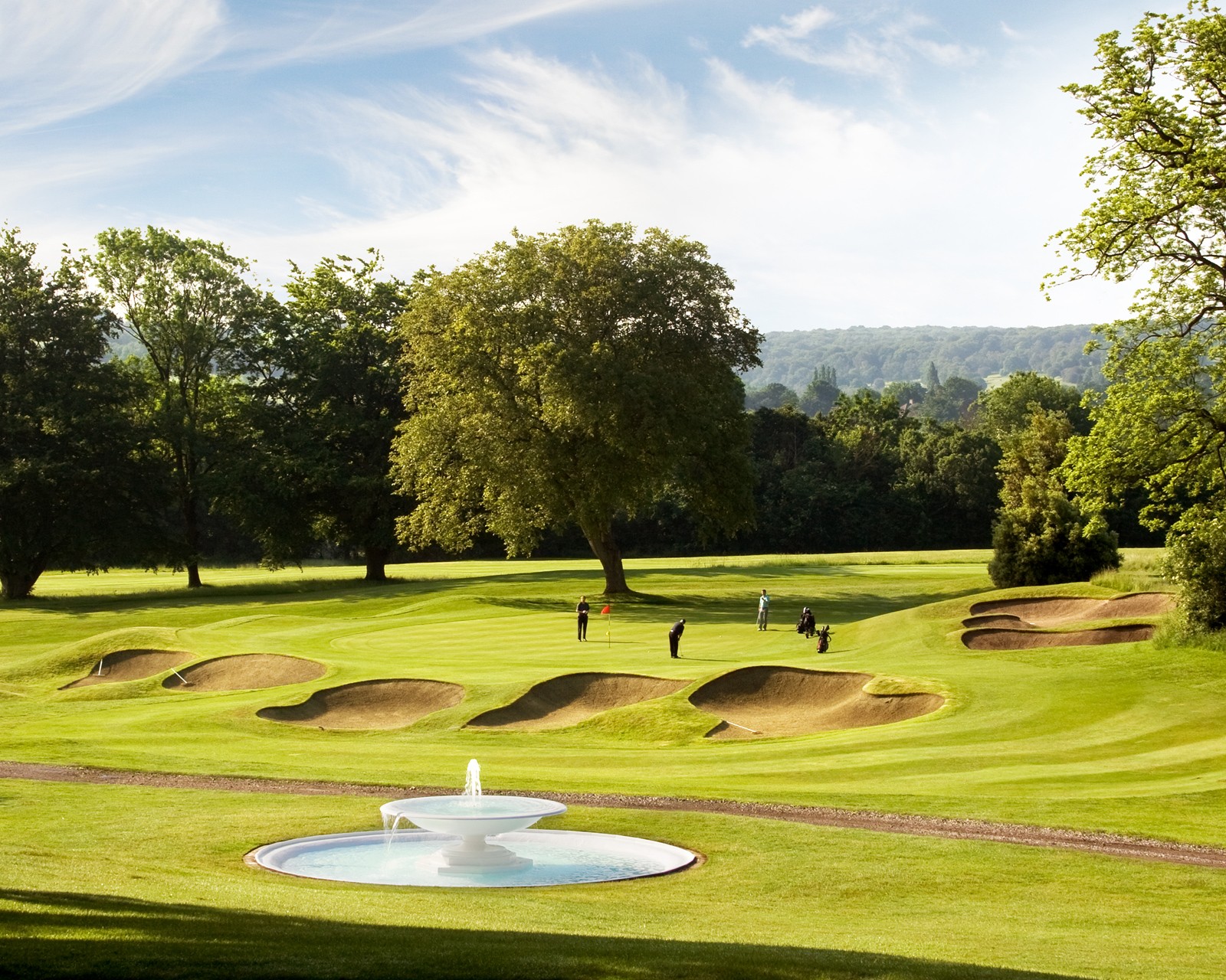 Group of golfers putting on hole 3 at Addington Palace Golf Club