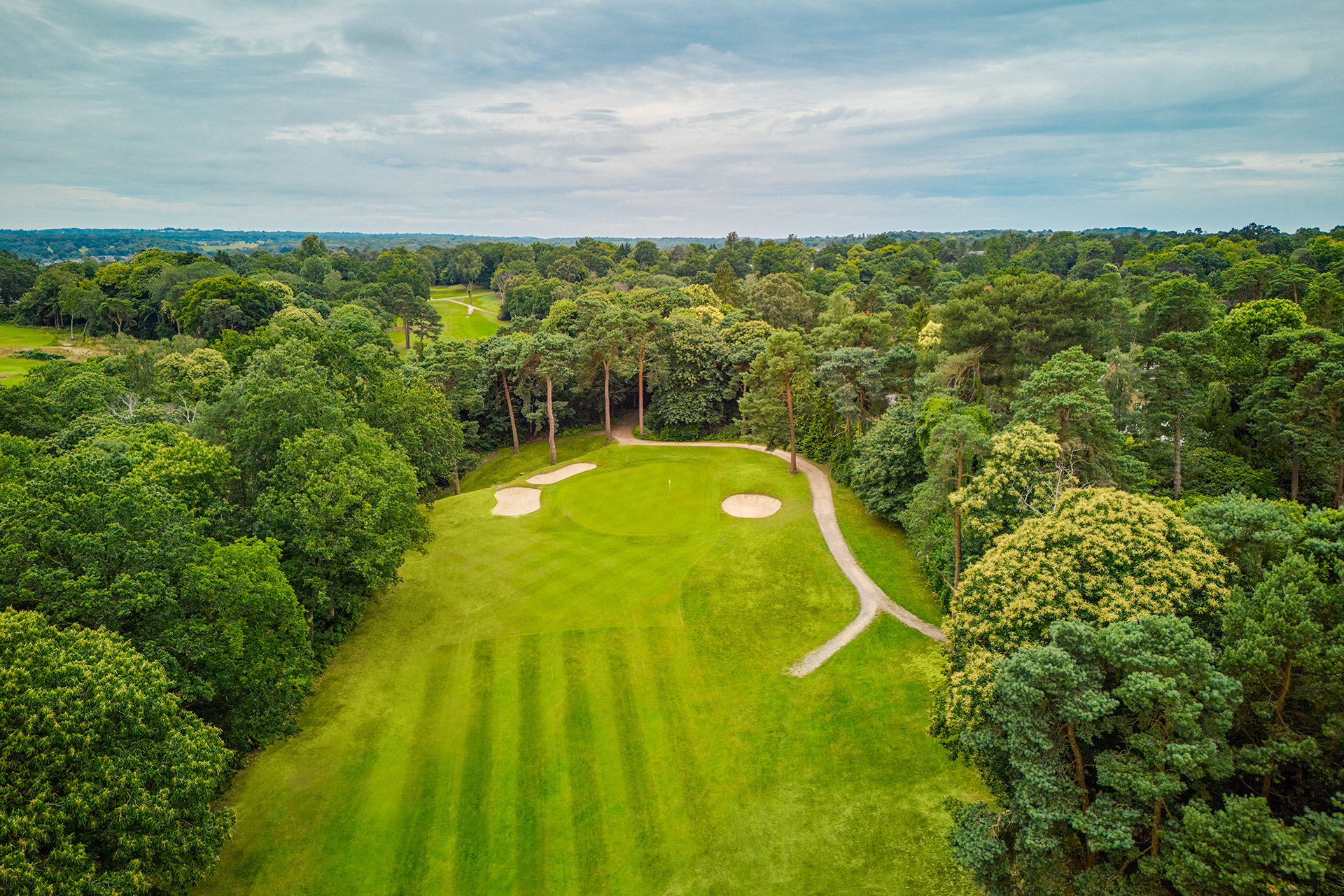Wide angle aerial view of the 14th green at Addington Palace Golf Club