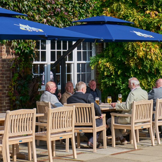 Addington Palace Golf Club members enjoying a drink and a chat outside at the clubhouse